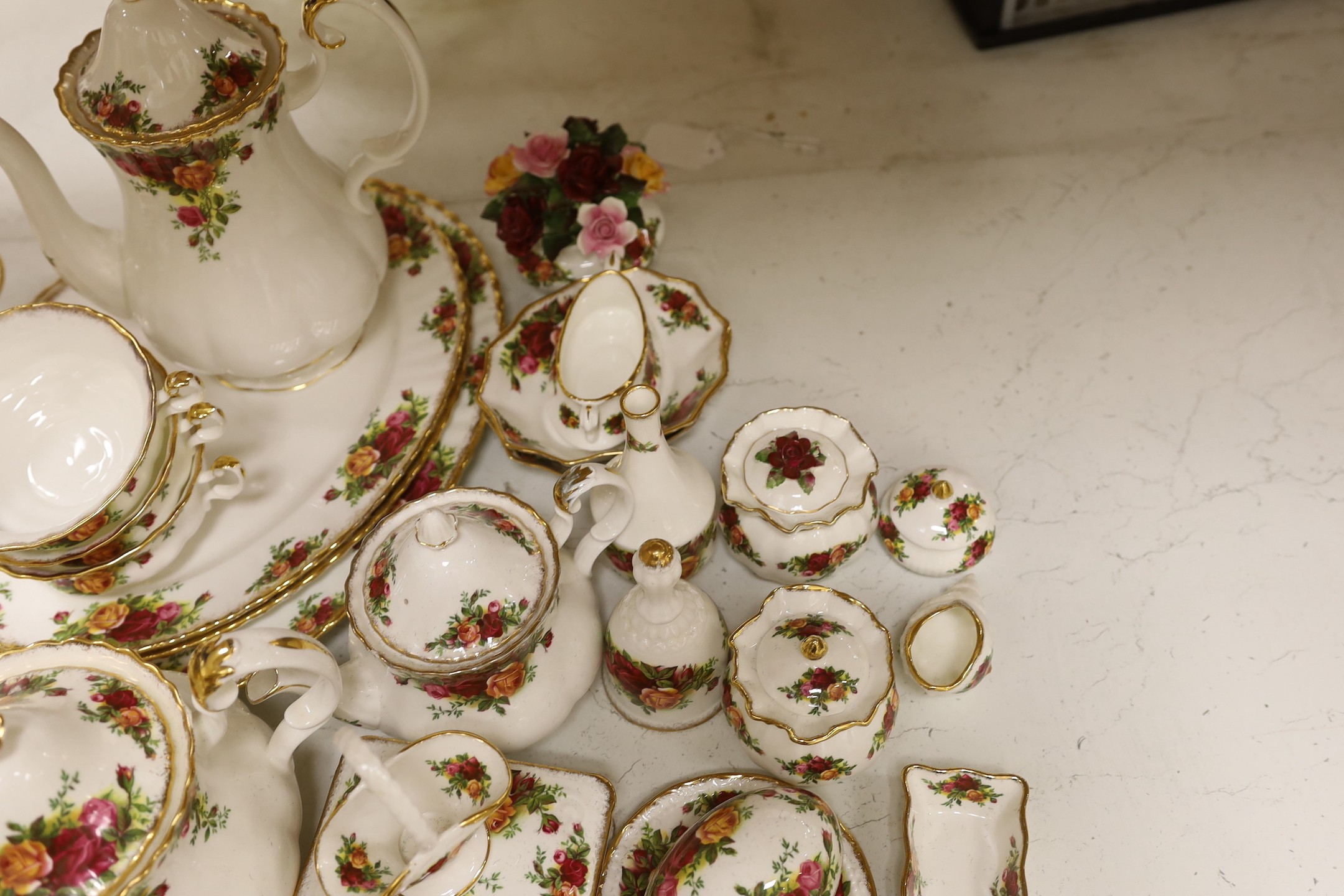A collection of Royal Albert Old Country Roses tea and dinner service including a collection of vases, pots etc